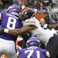 Minnesota Vikings quarterback Kirk Cousins (8) fumbles the ball as he is sacked for a 7-yard loss by Chicago Bears outside linebacker Khalil Mack, right, during the second half of an NFL football game Sunday, Sept. 29, 2019, in Chicago. The Bears recovered the fumble. (AP Photo/Matt Marton)