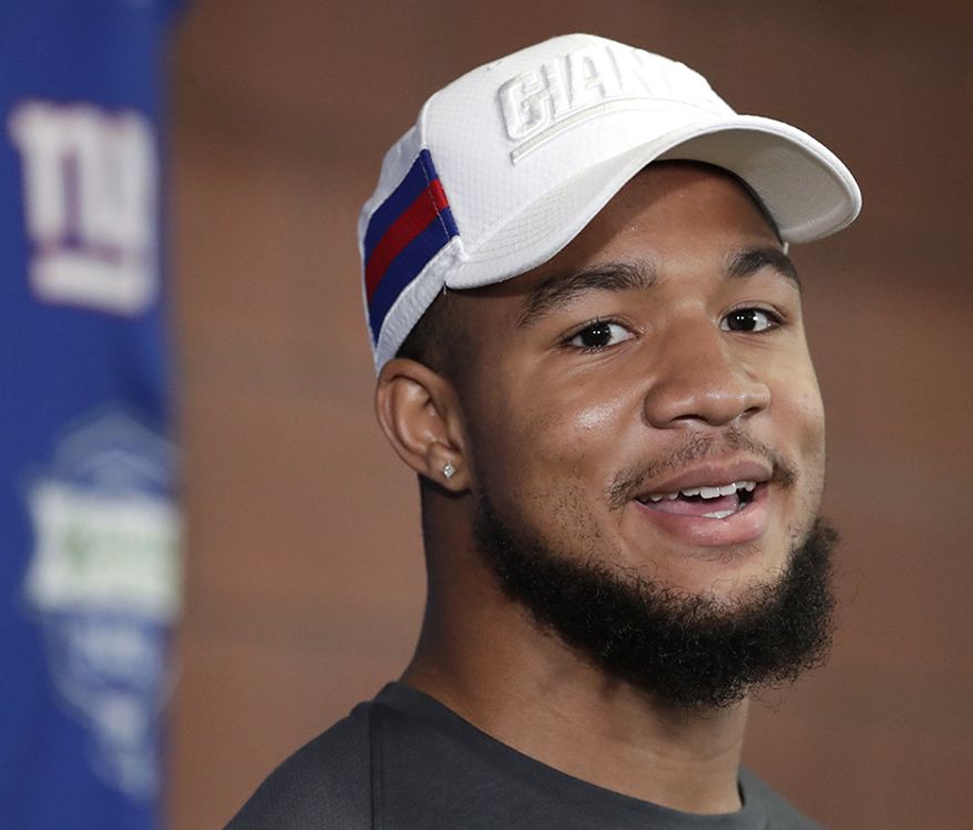 OSHANE XIMINES                                                                                              
Oshane Ximines, the New York Giants third round draft pick, talks to reporters during NFL football rookie camp, Friday, May 3, 2019, in East Rutherford, N.J. (AP Photo/Julio Cortez)