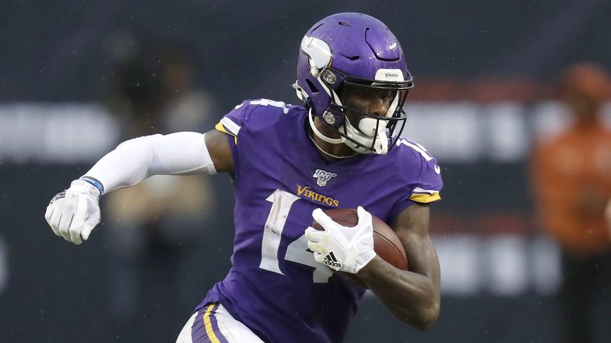 Minnesota Vikings' Stefon Diggs advances the ball during the second half of an NFL football game against the Chicago Bears Sunday, Sept. 29, 2019, in Chicago. (AP Photo/Charles Rex Arbogast)