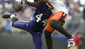 Baltimore Ravens cornerback Marlon Humphrey (44) disrupts a pass intended for Cleveland Browns wide receiver Odell Beckham (13) during the second half of an NFL football game Sunday, Sept. 29, 2019, in Baltimore. (AP Photo/Gail Burton)
