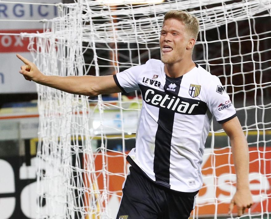 Parma's Andreas Cornelius jubilates after scoring a goal against Torino during the Italian Serie A soccer match, Parma Calcio vs Torino FC at the Ennio Tardini stadium in Parma, Italy, Monday Sept. 30, 2019. (Serena Campanini/ANSA via AP)