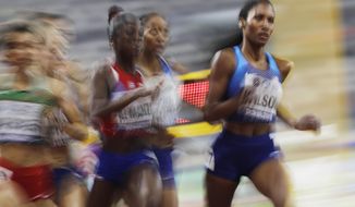 Ajee Wilson, of the United States, leads a the women&#39;s 800 meter semifinal at the World Athletics Championships in Doha, Qatar, Saturday, Sept. 28, 2019. (AP Photo/Petr David Josek)