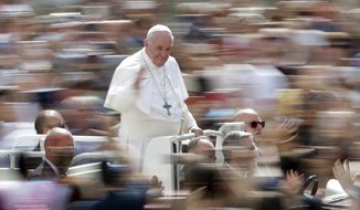 Pope Francis greets faithful after celebrating Mass on the occasion of the Migrant and Refugee World Day, in St. Peter&#39;s Square, at the Vatican, Sunday, Sept. 29, 2019. (AP Photo/Andrew Medichini)