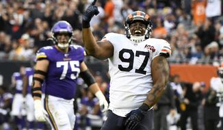 Chicago Bears defensive tackle Nick Williams (97) celebrates after sacking Minnesota Vikings quarterback Kirk Cousins as Vikings&#39; Brian O&#39;Neill (75) watches during the second half of an NFL football game Sunday, Sept. 29, 2019, in Chicago. (AP Photo/Matt Marton)