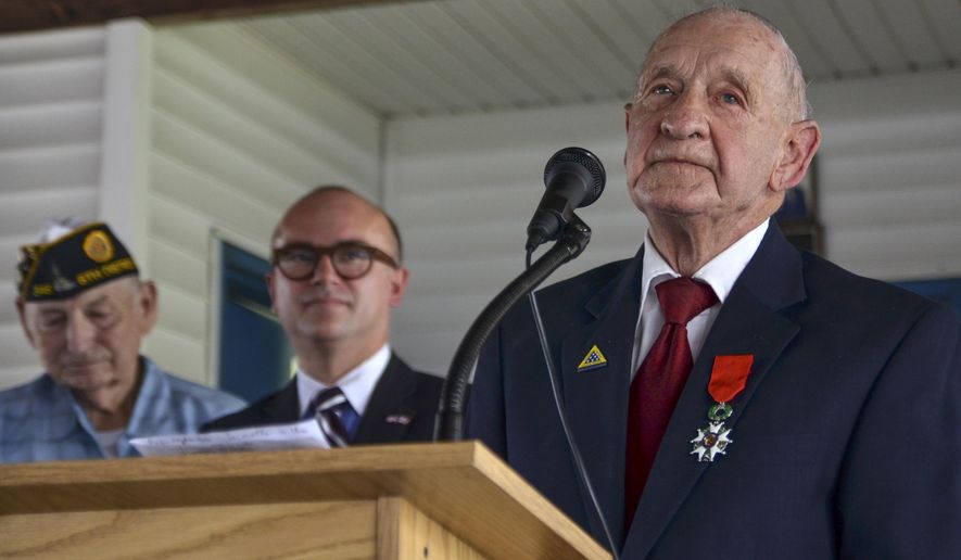 WWII veteran Jimmie H. Royer thanks everyone at the ceremony where Royer was awarded France's Legion of Honor at VFW Post 346 in Terre Haute, Ind., Sunday, Sept. 29, 2019. The 94-year-old World War II veteran from western Indiana received the medal Sunday for his wartime service. (Austen Leake/The Tribune-Star via AP)