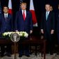 President Donald Trump stands with Japanese Prime Minister Shinzo Abe before signing an agreement on trade at the InterContinental Barclay New York hotel during the United Nations General Assembly, Wednesday, Sept. 25, 2019, in New York. From left, Japanese Foreign Minister Toshimitsu Motegi, Abe, Trump, and U.S. Trade Representative Robert Lighthizer. (AP Photo/Evan Vucci) ** FILE **