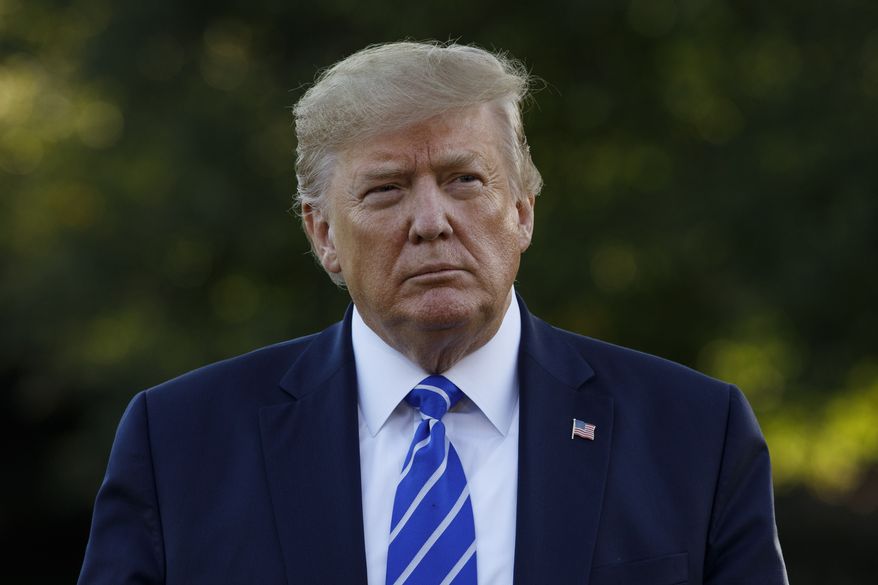 President Donald Trump walks to speak to the media and boarding Maine One at the White House in Washington, Friday, Aug. 30, 2019, en route to Camp David in Maryland. (AP Photo/Carolyn Kaster)