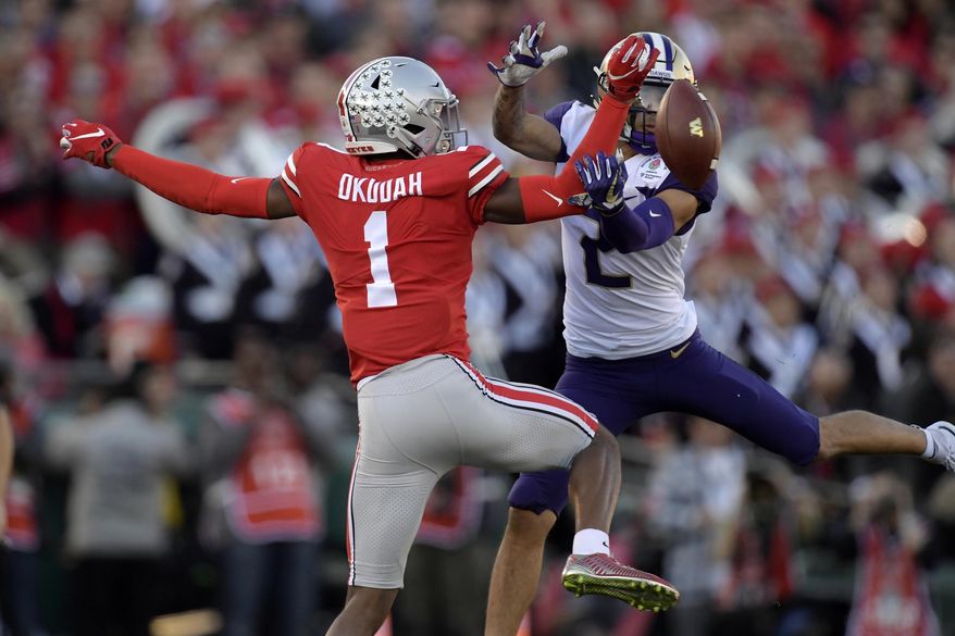 FILE - In this Jan. 1, 2019, file photo, Ohio State cornerback Jeffrey Okudah breaks up a pass intended for Washington wide receiver Aaron Fuller during the first half of the Rose Bowl NCAA college football game in Pasadena, Calif. NFL scouts already had taken notice of Ohio State cornerback Jeffrey Okudah, even though the junior had yet to record an interception in his first two years. Now Okudah has three picks in the past two weeks and his NFL stock is rising. (AP Photo/Mark J. Terrill, File)