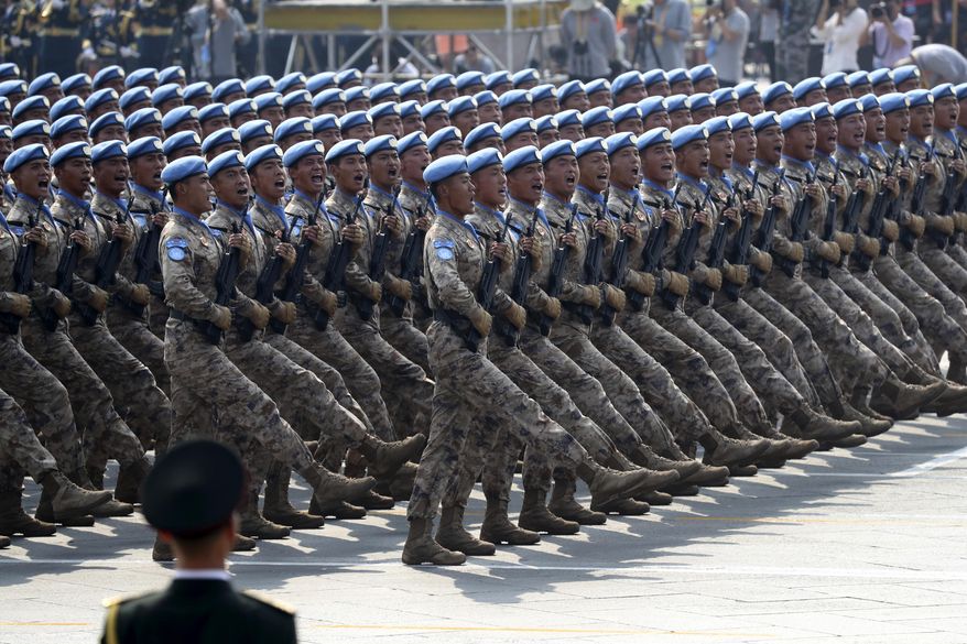 Chinese military personnel march during the parade to commemorate the 70th anniversary of the founding of Communist China in Beijing, Tuesday, Oct. 1, 2019. (AP Photo/Ng Han Guan)