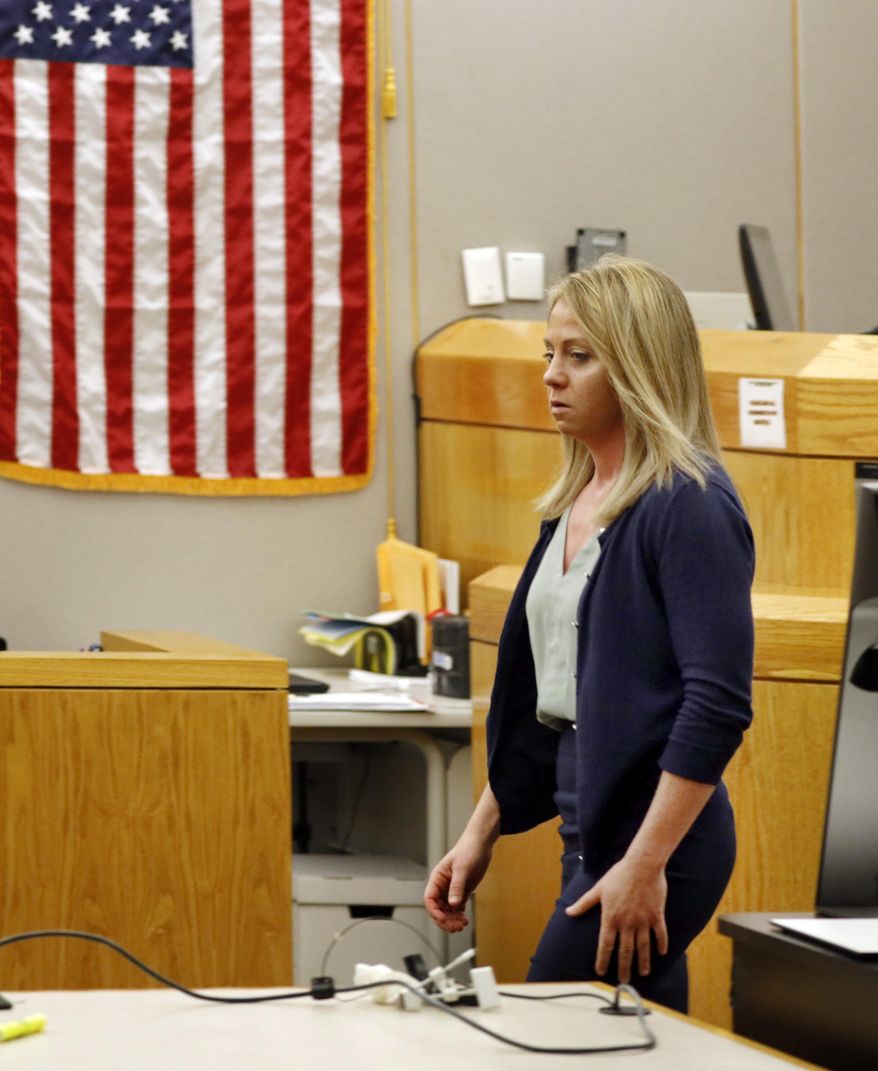 Fired Dallas police officer Amber Guyger walks out of the courtroom after a jury found her guilty of murder Tuesday, Oct. 1, 2019, in Dallas. Guyger shot and killed Botham Jean, an unarmed 26-year-old neighbor in his own apartment last year. She told police she thought his apartment was her own and that he was an intruder. (Tom Fox/The Dallas Morning News via AP, Pool)
