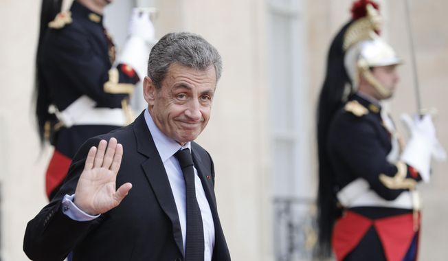 Former French President Nicolas Sarkozy leaves the Elysee Palace after a lunch with heads of states and officials, Monday, Sept. 30, 2019 in Paris. France bid a final adieu to former French President Jacques Chirac on Monday as he received military honors on a national day of mourning that culminated with a memorial service attended by dozens of past and current world leaders. (AP Photo/Kamil Zihnioglu)