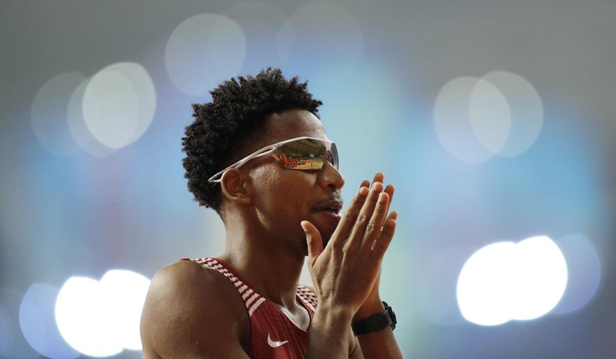 Abderrahman Samba, of Qatar, prepares for a men's 400m hurdles semifinal race at the World Athletics Championships in Doha, Qatar, Saturday, Sept. 28, 2019. (AP Photo/Petr David Josek)