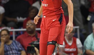 Washington Mystics forward Elena Delle Donne stands on the court in the first half of Game 2 of basketball&#39;s WNBA Finals against the Connecticut Sun, Tuesday, Oct. 1, 2019, in Washington. (AP Photo/Nick Wass)