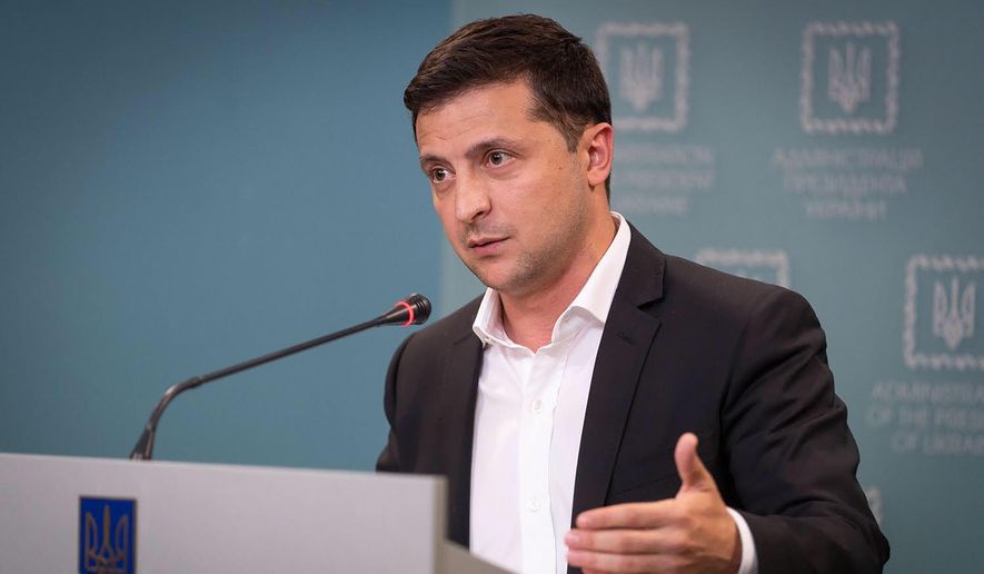 Ukrainian President Volodymyr Zelensky speaks to media during his press conference in Kyiv, Ukraine, Tuesday, Oct. 1, 2019. Ukraine on Tuesday signed much-anticipated accords with separatists from the country&#x27;s east, Russia and European monitors that agree a local election can be held in separatist-controlled territory, paving the way for peace talks with Moscow. (Ukrainian Presidential Press Office via AP)