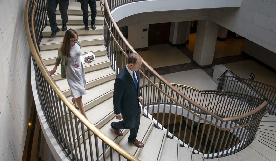 House Intelligence Committee Chairman Adam Schiff, D-Calif., descends the stairs on the way to a secure room at the Capitol following a news conference with Speaker of the House Nancy Pelosi, D-Calif., as House Democrats move ahead in the impeachment inquiry of President Donald Trump, in Washington, Wednesday, Oct. 2, 2019. (AP Photo/J. Scott Applewhite)