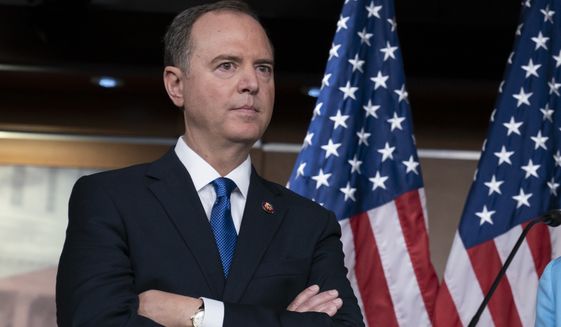 House Intelligence Committee Chairman Adam Schiff, D-Calif., listens at a news conference as House Democrats move ahead in the impeachment inquiry of President Donald Trump, at the Capitol in Washington, Wednesday, Oct. 2, 2019. In an unusual show of anger today, President Donald Trump defended his phone call with the president of Ukraine and said Adam Schiff may have committed treason by investigating the matter. (AP Photo/J. Scott Applewhite)