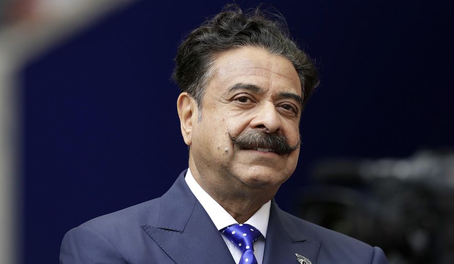 In this Sept. 24, 2017 file photo, Jacksonville Jaguars owner Shahid Khan stands before an NFL football game against between the Jaguars and the Baltimore Ravens at Wembley Stadium in London. Khan announced Wednesday, Oct. 2, 2019, that he is a majority investor in the nation&#39;s only 24-hour news network aimed at African American viewers. The network is to begin broadcasting in November and will be based in Tallahassee, Florida&#39;s capital, with bureaus around the country. (AP Photo/Matt Dunham, File)