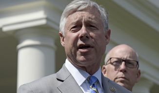 FILE - In this May 3, 2017, file photo, Rep. Fred Upton, R-Mich., left, speaks to reporters outside the White House in Washington. Upton, said he doesn&#39;t support a formal impeachment inquiry against President Donald Trump. But he has no problem with Democratic-led committees digging for more information. Upton told the Detroit Economic Club that &amp;quot;we need to know what the answers are.&amp;quot; He shared the stage Wednesday, Oct. 2, 2019 with Democratic Rep. Debbie Dingell. (AP Photo/Susan Walsh, File)