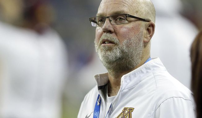 FILE - In this Dec. 28, 2015, file photo, former Minnesota head football coach Jerry Kill watches from the sidelines during the first half of the Quick Lane Bowl NCAA college football game against Central Michigan in Detroit. Some of the most experienced head coaches in the Atlantic Coast Conference aren’t exactly coaches anymore. North Carolina, Florida State and Virginia Tech have hired former head coaches to advisory or analytical positions in the past 10 months. The programs benefit from having an extra voice of experience. The ex-coaches themselves see it as a way to stay involved in the sport without having to do any on-field coaching or recruiting. (AP Photo/Carlos Osorio, File)