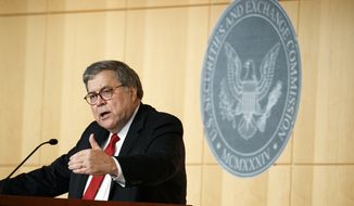 Attorney General Barr William Barr speaks at the Securities and Exchange Commission (SEC) Criminal Coordination Conference, Thursday, Oct. 3, 2019, at the SEC in Washington. (AP Photo/Jacquelyn Martin)