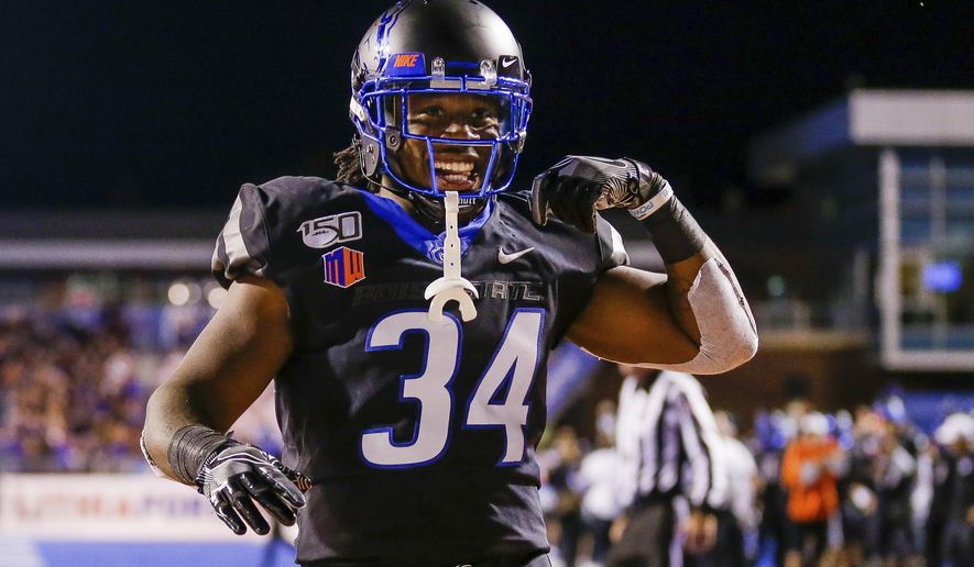 Boise State running back Robert Mahone celebrates after a 10-yard touchdown run against Air Force during the second half of an NCAA college football game Friday, Sept. 20, 2019, in Boise, Idaho. Boise State won 30-19. (AP Photo/Steve Conner)