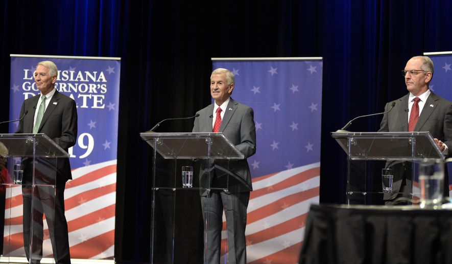 Gubernatorial candidates, from left, U.S. Rep. Ralph Abraham, Eddie Rispone, and Gov. John Bel Edwards, face each other in the second debate, hosted by Louisiana Public Broadcasting, on Thursday, Sept. 26, 2019, at Angelle Hall on the campus of the University of Louisiana at Lafayette in Lafayette, La.  (Brad Bowie /The Daily Advertiser via AP)