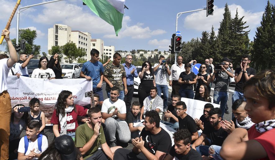 Israeli Arabs protest a wave of deadly violence within the minority community, in Nazareth, Israel, Thursday, Oct. 3, 2019. Police say there have been more than 70 killings in Arab communities this year, nearly as many as in each of the past two years, when Arabs made up more than half of all murder victims nationwide. (AP Photo/Gil Eliyahu-JINIPIX)