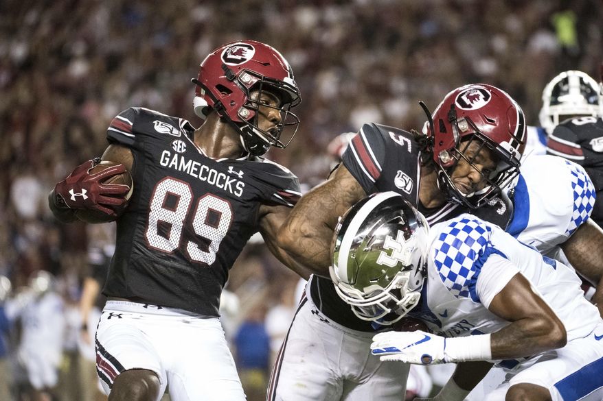South Carolina wide receiver Bryan Edwards (89) runs with the ball behind a block by Rico Dowdle (5) against Kentucky during the first half of an NCAA college football game Saturday, Sept. 28, 2019, in Columbia, S.C. (AP Photo/Sean Rayford)