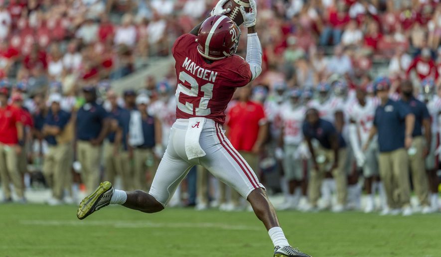 Alabama defensive back Jared Mayden (21) makes an interception against Mississippi during the second half of an NCAA college football game, Saturday, Sept. 28, 2019, in Tuscaloosa, Ala. (AP Photo/Vasha Hunt)