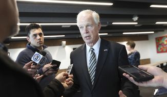 In this file photo, U.S. Sen. Ron Johnson, R-Wis., speaks with members of the media in Madison, Wis., Thursday, Oct. 3, 2019.  (Amber Arnold/Wisconsin State Journal via AP)  **FILE**