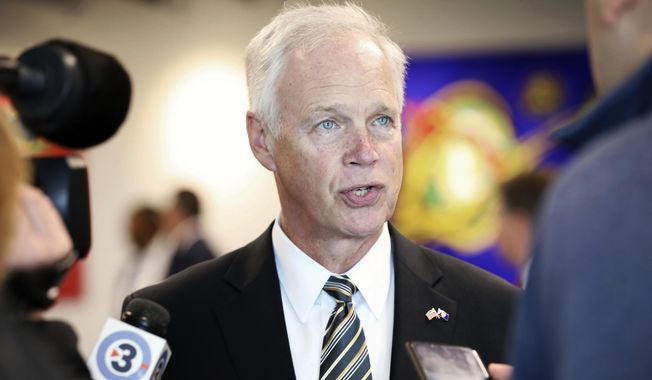 Sen. Ron Johnson, R-Wis., speaks with members of the media before meeting with the Middleton Chamber of Commerce at Serendipity Labs in Madison, Wis., Thursday, Oct. 3, 2019. (Amber Arnold/Wisconsin State Journal via AP) **FILE**