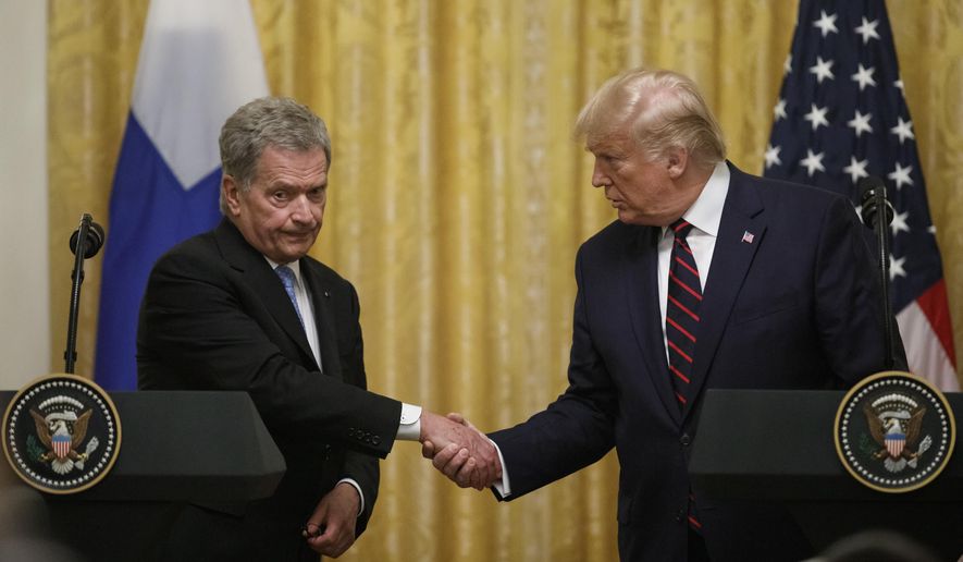 President Donald Trump and Finnish President Sauli Niinisto shake hands during a news conference at the White House in Washington, Wednesday, Oct. 2, 2019. (AP Photo/Carolyn Kaster)