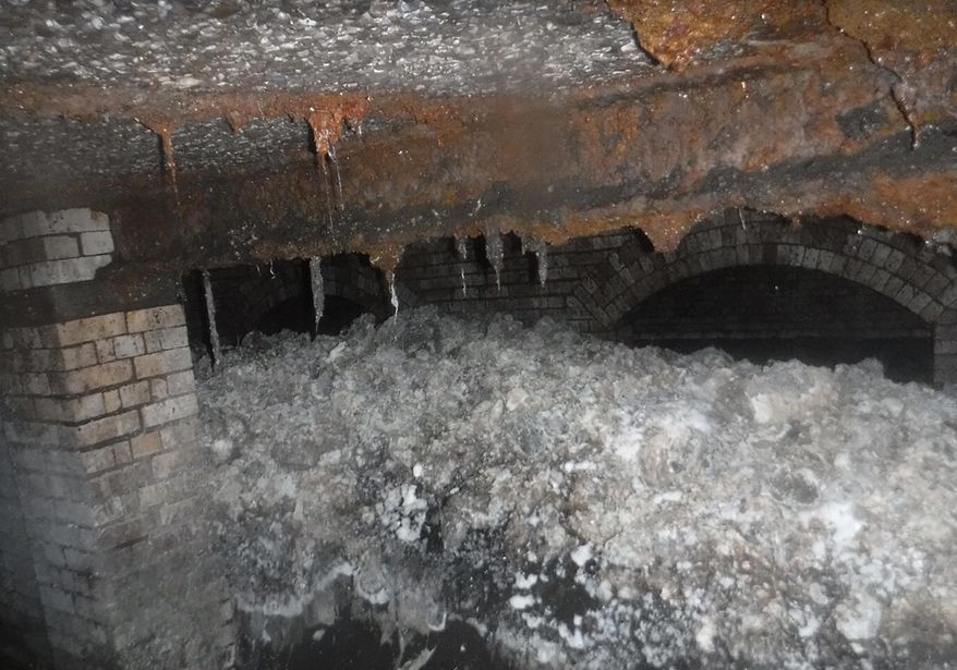 In this image released Friday Oct. 4, 2019, by University of Exeter, showing a fatberg in a sewer beneath Sidmouth, England, in January 2019, during scientific analysis conducted by the university to find out exactly what the fatberg was made of. University of Exeter scientists said Friday Oct. 4, 2019, there were no detectible levels of toxic chemicals in the fatberg, which filled 36 tanker loads when it was removed from underneath the seaside town of Sidmouth. (University of Exeter via AP)