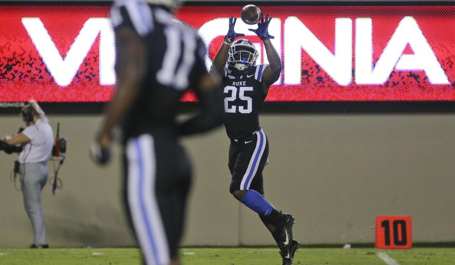 Duke's Deon Jackson (25) catches a 25-yard touchdown pass in the second quarter of an NCAA college football game against Virginia Tech, Friday, Sept. 27, 2019, in Blacksburg, Va. (Matt Gentry/The Roanoke Times via AP)