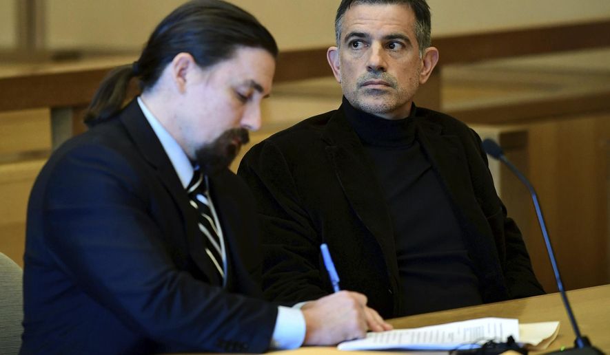 Fotis Dulos, charged with two counts of tampering with evidence and hindering prosecution in the disappearance of his wife, appears with his attorney in Stamford Superior Court following a for a pre-trial hearing Friday, Oct. 4, 2019, in Stamford, Conn. (Erik Trautmann/Hearst Connecticut Media via AP)