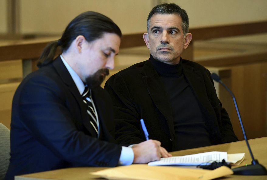 Fotis Dulos, charged with two counts of tampering with evidence and hindering prosecution in the disappearance of his wife, appears with his attorney in Stamford Superior Court following a for a pre-trial hearing Friday, Oct. 4, 2019, in Stamford, Conn. (Erik Trautmann/Hearst Connecticut Media via AP)