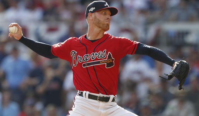 Atlanta Braves starting pitcher Mike Foltynewicz (26) works in the first inning during Game 2 of a best-of-five National League Division Series against the St. Louis Cardinals, Friday, Oct. 4, 2019, in Atlanta. (AP Photo/John Bazemore)
