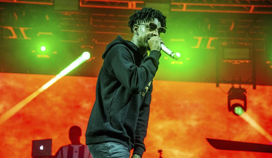 FILE - In this Oct. 28, 2018, file photo, 21 Savage performs at the Voodoo Music Experience in New Orleans. (Photo by Amy Harris/Invision/AP, File)