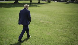 President Donald Trump walks across the South Lawn of the White House in Washington, Friday, Oct. 4, 2019, before boarding Marine One helicopter for the short trip to nearby Walter Reed National Military Medical Center in Bethesda, Md. (AP Photo/Pablo Martinez Monsivais)