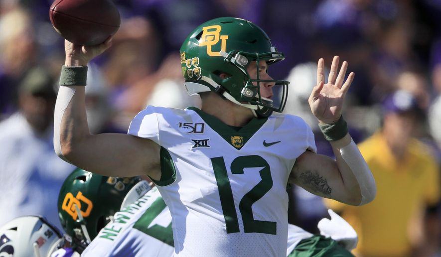 Baylor quarterback Charlie Brewer (12) passes to a teammate during the first half of an NCAA college football game against Kansas State in Manhattan, Kan., Saturday, Oct. 5, 2019. (AP Photo/Orlin Wagner)