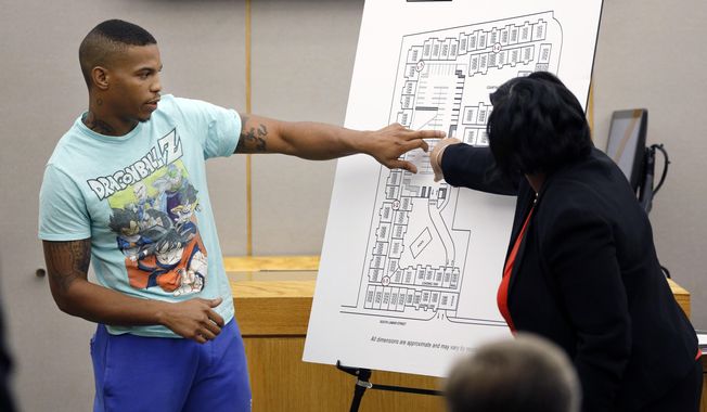 In this Tuesday, Sept. 24, 2019, photo, victim Botham Jean&#x27;s neighbor Joshua Brown, left, answers questions from Assistant District Attorney LaQuita Long, right, while pointing to a map of the South Side Flats where he lives, while testifying during the murder trial of former Dallas Police Officer Amber Guyger, in Dallas. Authorities say that Brown was killed in a shooting Friday, Oct. 4. (Tom Fox/The Dallas Morning News via AP, Pool)