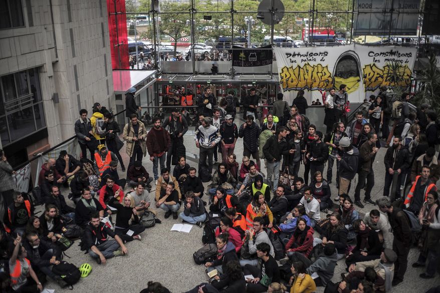 Extinction Rebellion climate activists protest at the shopping center "Italie 2", in Paris, France, Saturday, Oct. 5, 2019. (AP Photo/Rafael Yaghobzadeh)