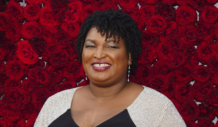Former Georgia House Minority Leader Stacey Abrams poses for a photo on the red carpet at the grand opening of Tyler Perry Studios on Saturday, Oct. 5, 2019, in Atlanta. (Photo by Elijah Nouvelage/Invision/AP) ** FILE **