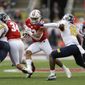 Wisconsin running back Jonathan Taylor (23) runs against Kent State cornerback Keith Sherald Jr. (15) during the first half of an NCAA college football game Saturday, Oct. 5, 2019, in Madison, Wis. (AP Photo/Andy Manis)