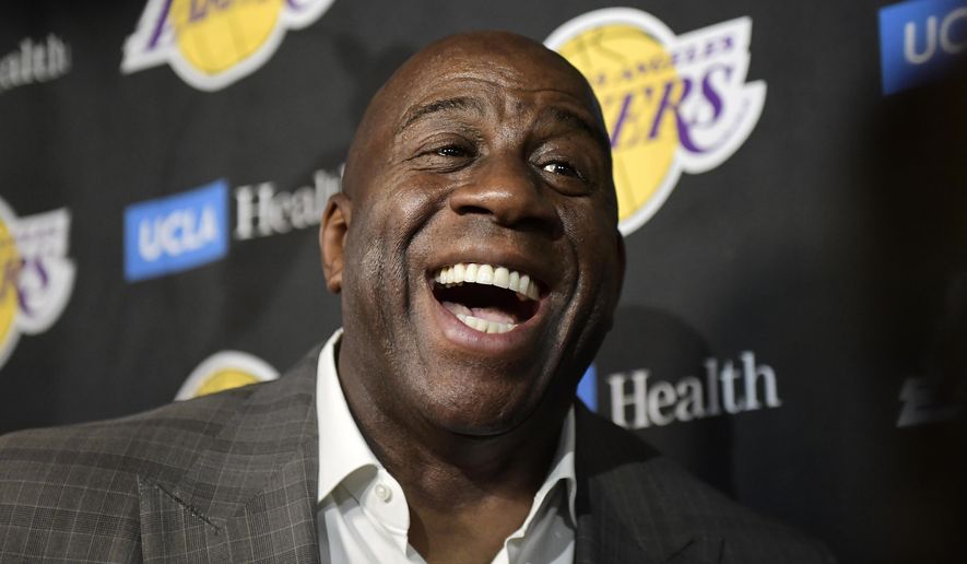 In this April 9, 2019, file photo, Magic Johnson speaks to reporters prior to an NBA basketball game between the Los Angeles Lakers and the Portland Trail Blazer in Los Angeles. (AP Photo/Mark J. Terrill, File)