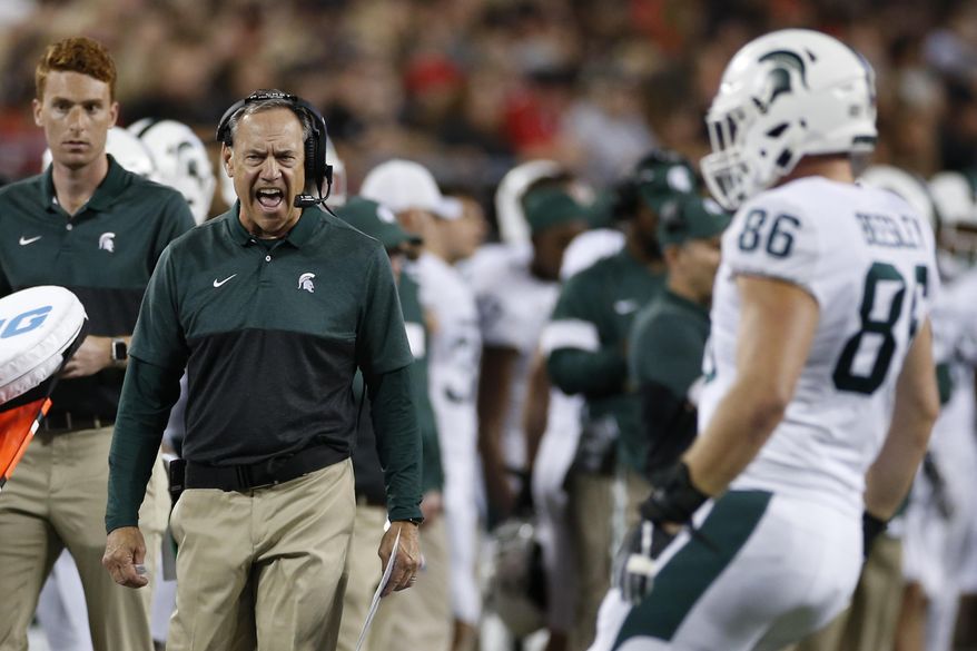 Michigan State coach Mark Dantonio shout to a player during the first half of the team's NCAA college football game against Ohio State on Saturday, Oct. 5, 2019, in Columbus, Ohio. (AP Photo/Jay LaPrete)