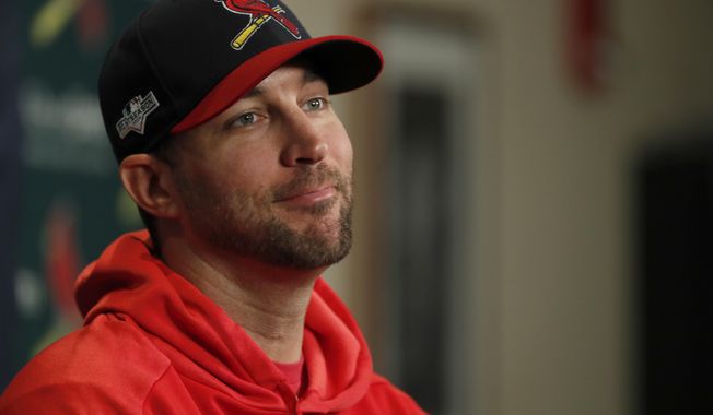 St. Louis Cardinals starting pitcher Adam Wainwright listens to a question during a news conference at the baseball National League Division Series Saturday, Oct. 5, 2019, in St. Louis. Wainwright is expected to start when the Cardinals play Game 3 of the series against the Atlanta Braves on Sunday in St. Louis. (AP Photo/Jeff Roberson)