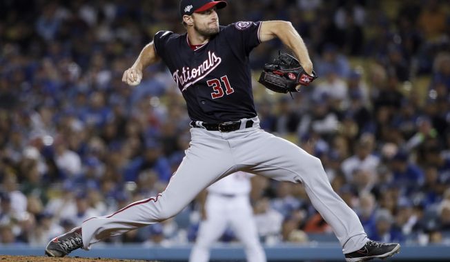 Washington Nationals pitcher Max Scherzer throws to a Los Angeles Dodgers batter during the eighth inning in Game 2 of a baseball National League Division Series on Friday, Oct. 4, 2019, in Los Angeles. (AP Photo/Marcio Jose Sanchez)