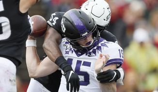 TCU quarterback Max Duggan fumbles as he is hit by Iowa State linebacker O&#39;Rien Vance (34) during the first half of an NCAA college football game, Saturday, Oct. 5, 2019, in Ames, Iowa. (AP Photo/Charlie Neibergall)