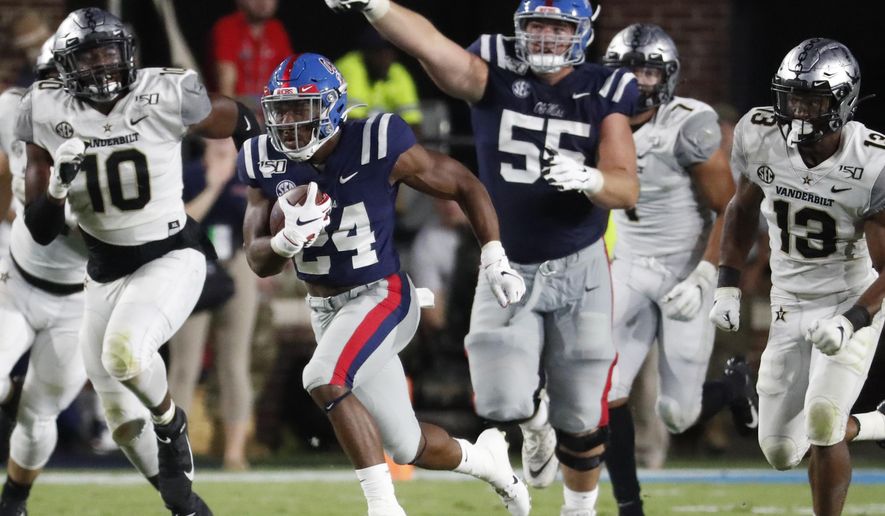 Mississippi offensive lineman Ben Brown (55) gestures as Mississippi running back Snoop Conner (24) heads for an 84-yard touchdown run against Vanderbilt during the second half of an NCAA college football game in Oxford, Miss., Saturday, Oct. 5, 2019. Mississippi won 31-6. (AP Photo/Rogelio V. Solis)